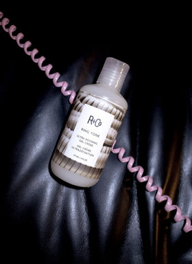 R+Co Ring Tone next to a ruler and hand for scale, illustrating the 177 ml size