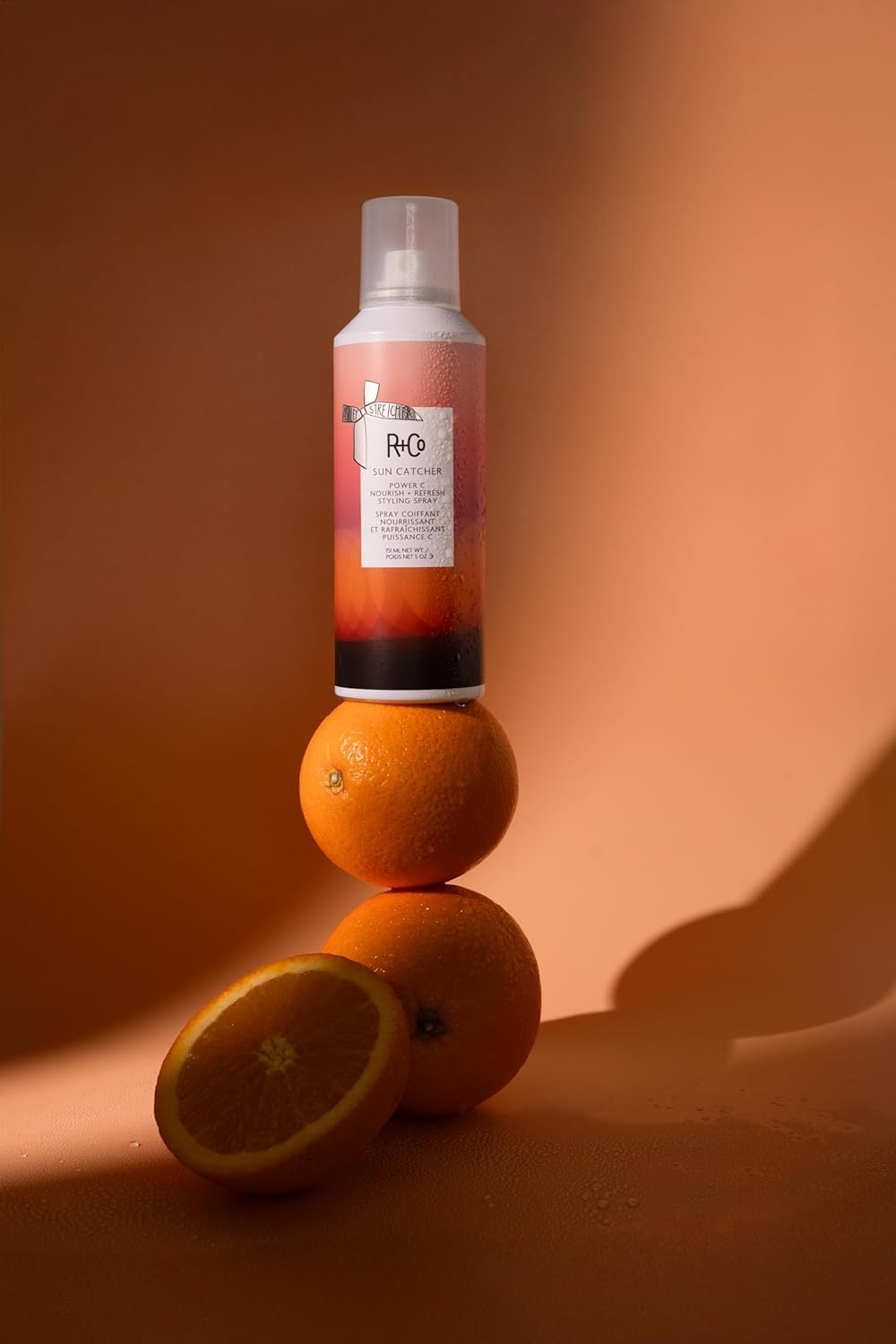 R+Co SUN CATCHER fine mist texture close-up demonstrating lightweight hydration