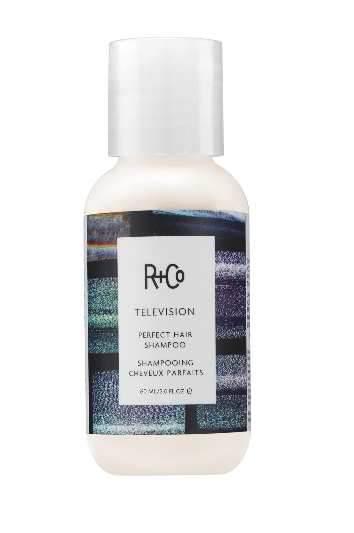 R+Co Television shampoo front view showing compact travel bottle and shine benefit