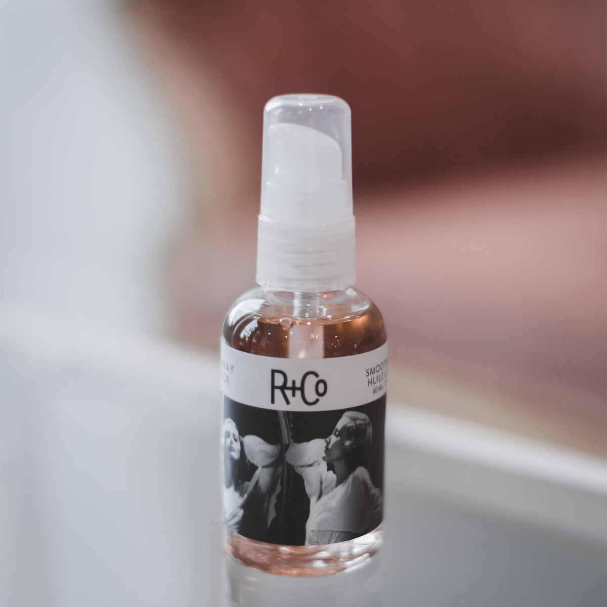 R+Co pump and label close-up highlighting product dispensing control