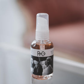 R+Co pump and label close-up highlighting product dispensing control