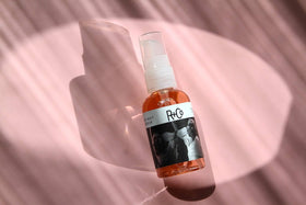 R+Co 60 ml bottle beside common items for scale and travel convenience