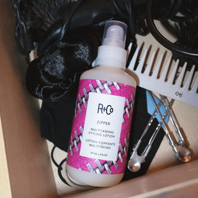 R+Co Zipper applied during blow-dry demonstrating frizz control and shine benefit