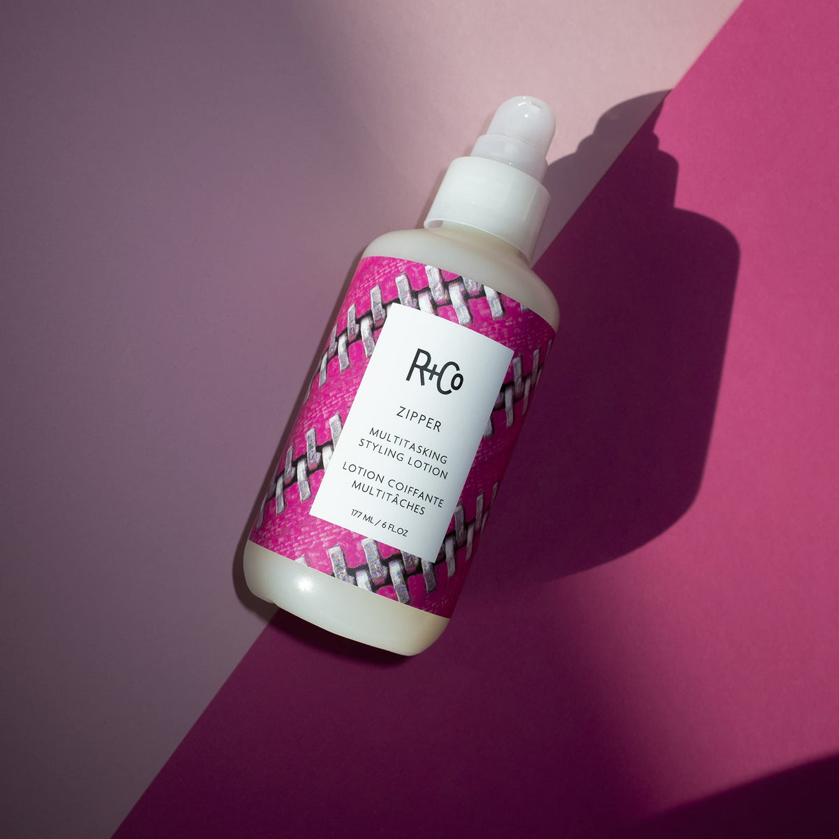 R+Co Zipper bottle beside common objects showing 6 oz size and travel-friendly benefit