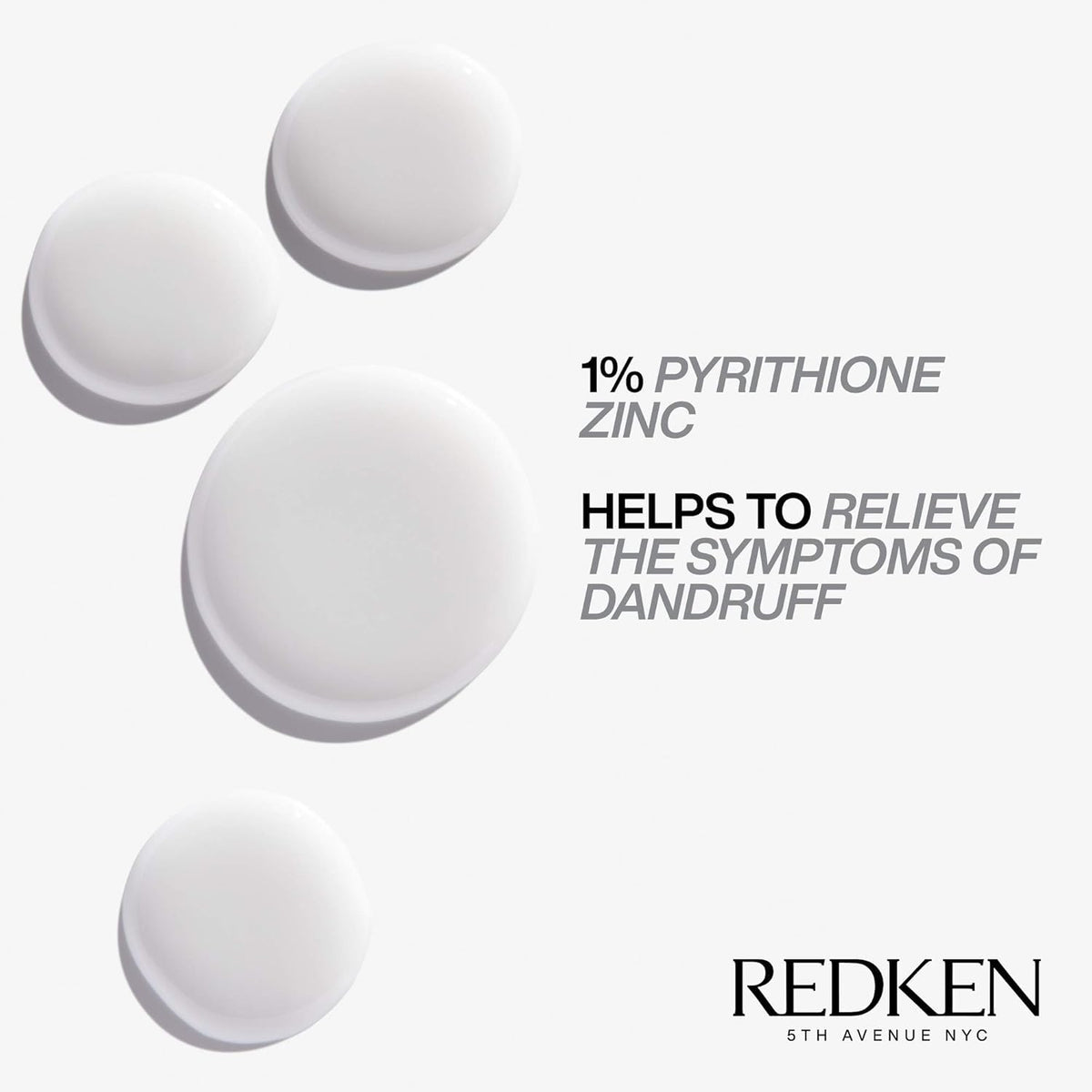 Redken 250ml bottle beside a hand for size and travel-friendly convenience