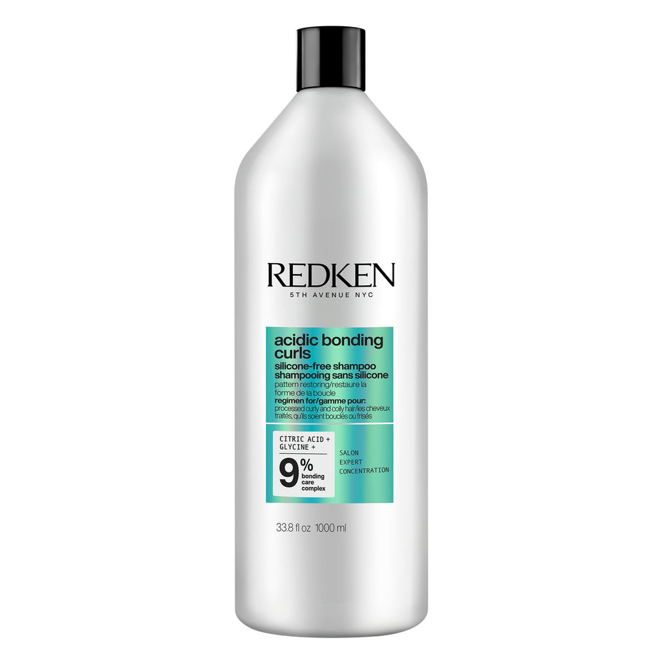 Redken bottle front view showing Acidic Bonding Curls shampoo and brand clarity