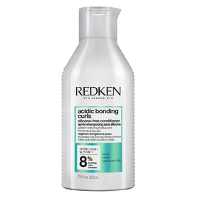 Redken bottle front packaging showing product and curly hair benefit