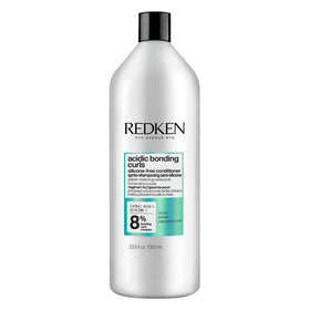 Redken front packaging showing product and benefit for curl repair