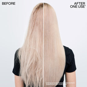 Redken applying mask to hair mid-lengths for deep hydration benefit