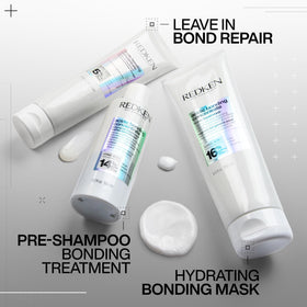 Redken product held in hand to show 8.5 fl oz size and scale