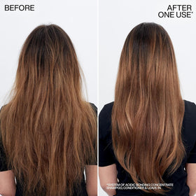 Redken shampoo bottle styled in bathroom setting showing professional, salon-ready care