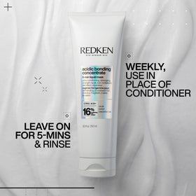 Redken acidic bonding concentrate next to ruler showing compact 1 fl oz travel size