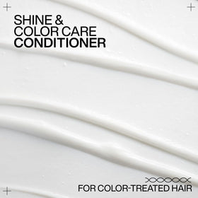 Model with glossy color-treated hair after using Redken for improved shine