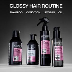 Redken conditioner displayed in salon setting suggesting professional results