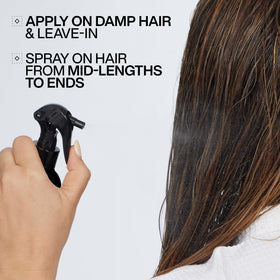 Redken bottle on bathroom shelf in lifestyle setting for daily use