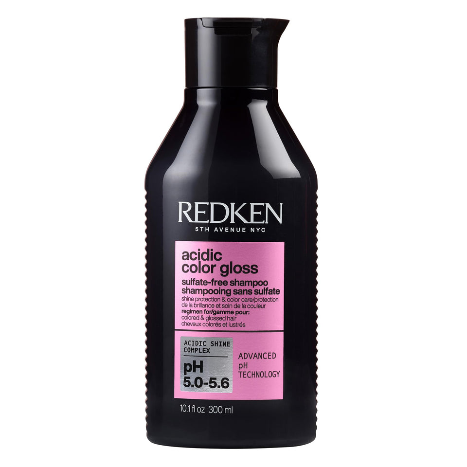 Redken bottle front view showing glossy salon packaging and color-care benefits