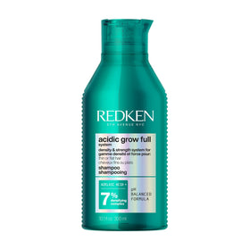 Redken front packaging showing bottle for fuller-looking hair benefit
