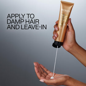 Redken bottle on bathroom shelf in routine setting, suggests daily styling readiness and protection