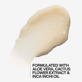 Redken applying conditioner to curly hair for improved manageability