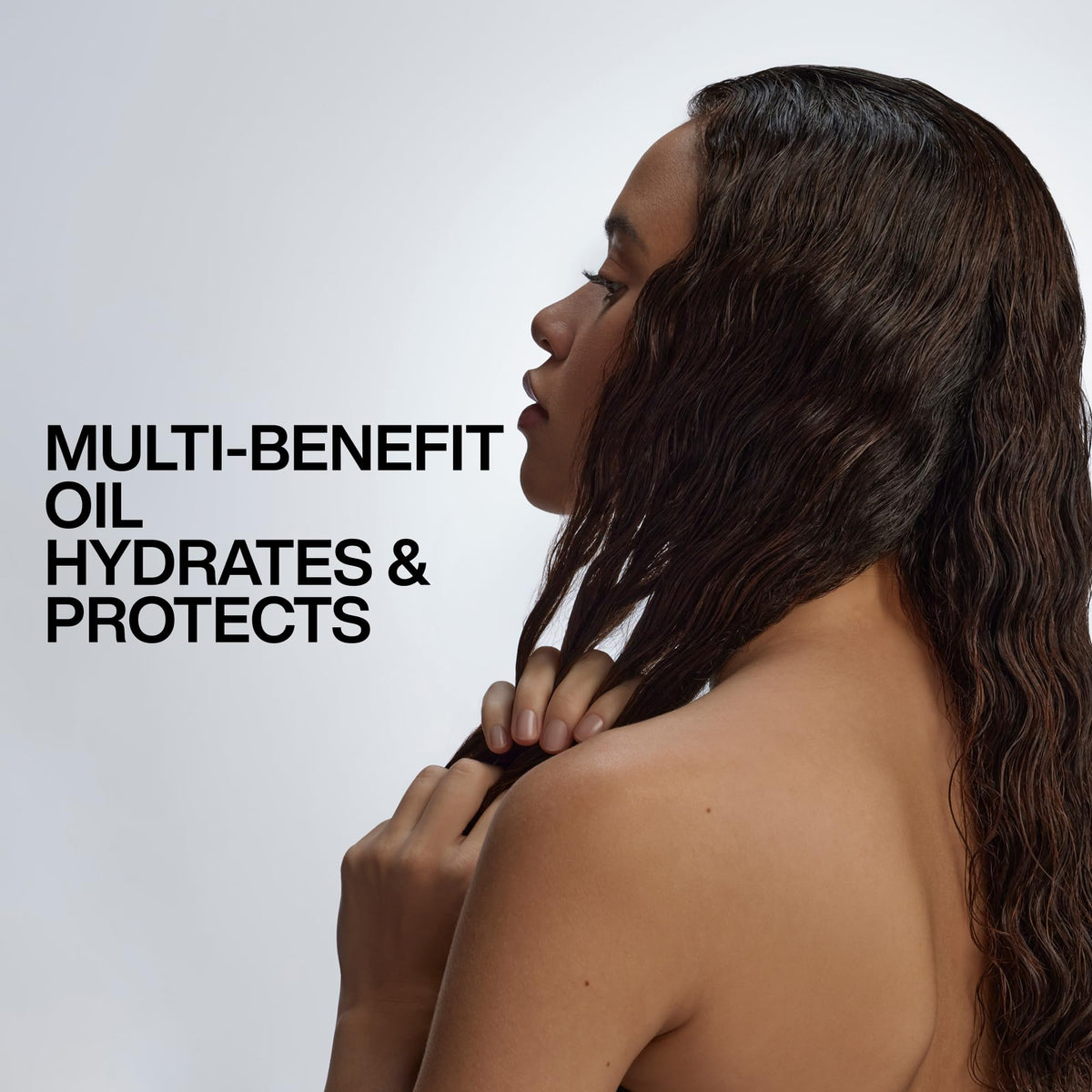 Redken label close-up highlighting argan oil and moisture complex