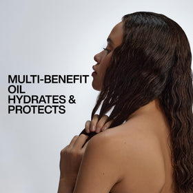Redken label close-up highlighting argan oil and moisture complex