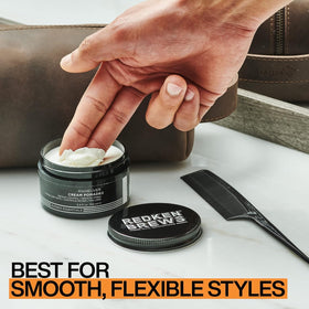Redken Brews cream pomade next to common items to show size and portability