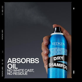Redken jumbo size next to standard can to show extended usage and value