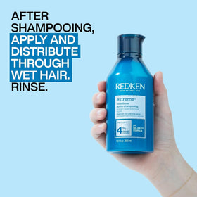 Redken Extreme Conditioner applied in shower demonstrating in-use conditioning and detangling benefit