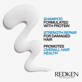 Foamy lather texture of Redken Extreme Shampoo demonstrating gentle cleansing