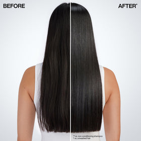 Redken applying mask to mid-lengths demonstrating quick hydration and smoothness