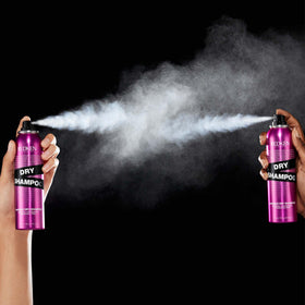Redken placed on bathroom counter in lifestyle setting for quick refresh