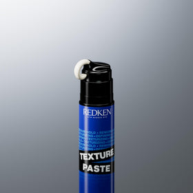 redken jar next to hand for scale to show compact travel-friendly size