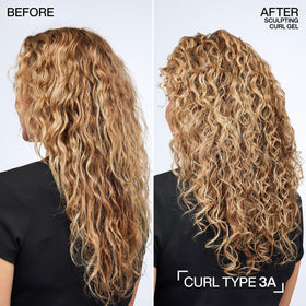 Redken being applied to damp hair for even curl definition and frizz control
