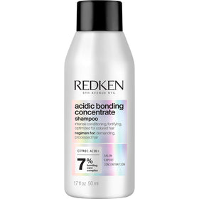 Redken front packaging shows compact bottle and professional repair benefit