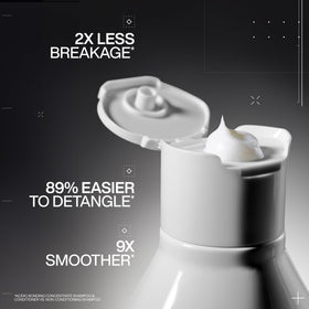 Redken thick cream texture closeup demonstrating concentrated coverage