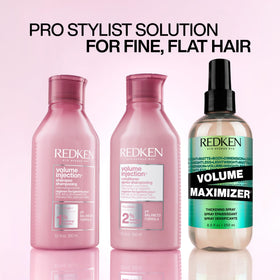 Redken conditioner being applied to fine hair demonstrating detangling benefit