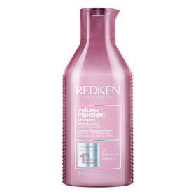 Redken bottle front view showing brand and volumizing benefit
