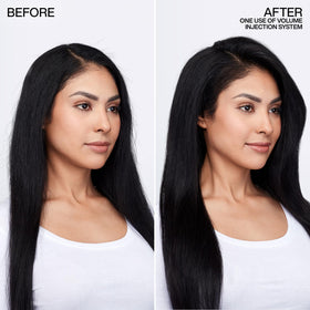 Redken Volume Injection bottle in hand to show the 33.8 fl oz scale and value