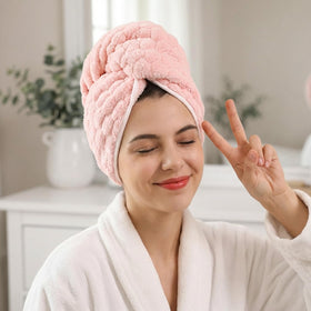 REDKISS towel beside hairbrush showing oversized 24x42 inch scale