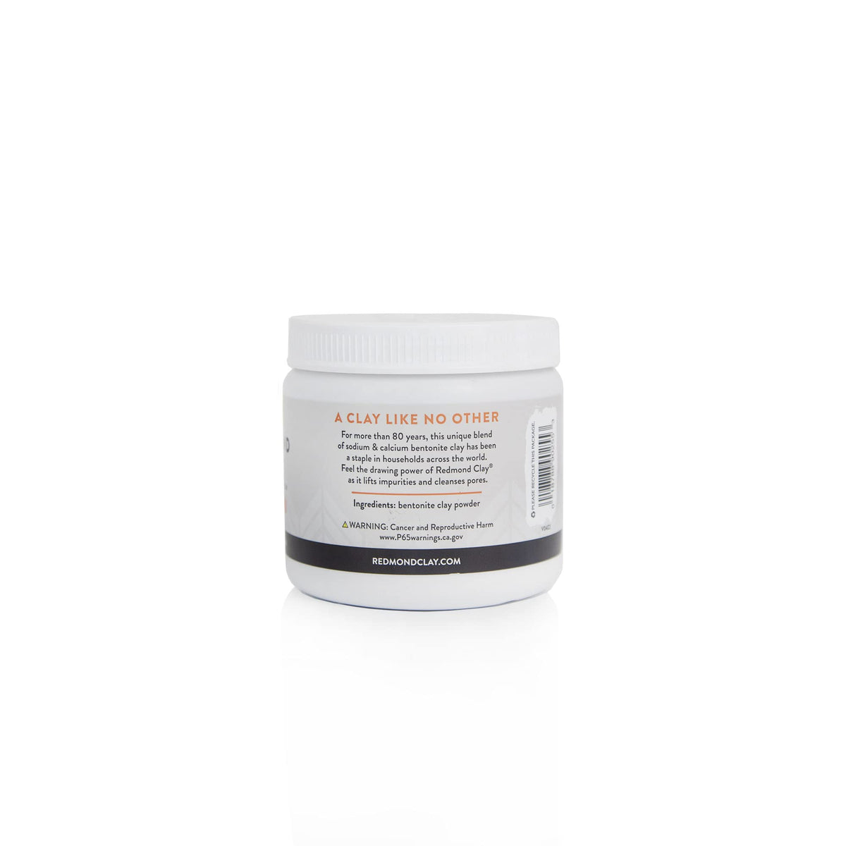 Person applying Redmond clay mask to cheek, brand visible, promotes clearer-looking skin