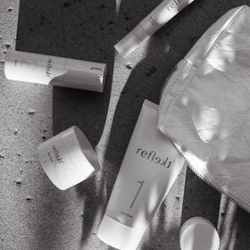 REFLEKT on bathroom shelf in styled routine showing clean cruelty-free benefit