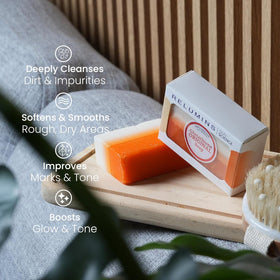 Relumins soap in hand during shower use illustrating easy application and rinse-off