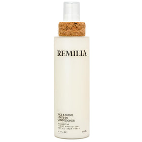 Remilia Hair front packaging showing bottle and branding benefit: clear product identity