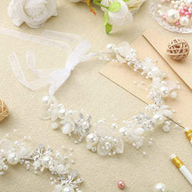 Retrowavy close-up rhinestones and pearls highlighting sparkle and refined detail