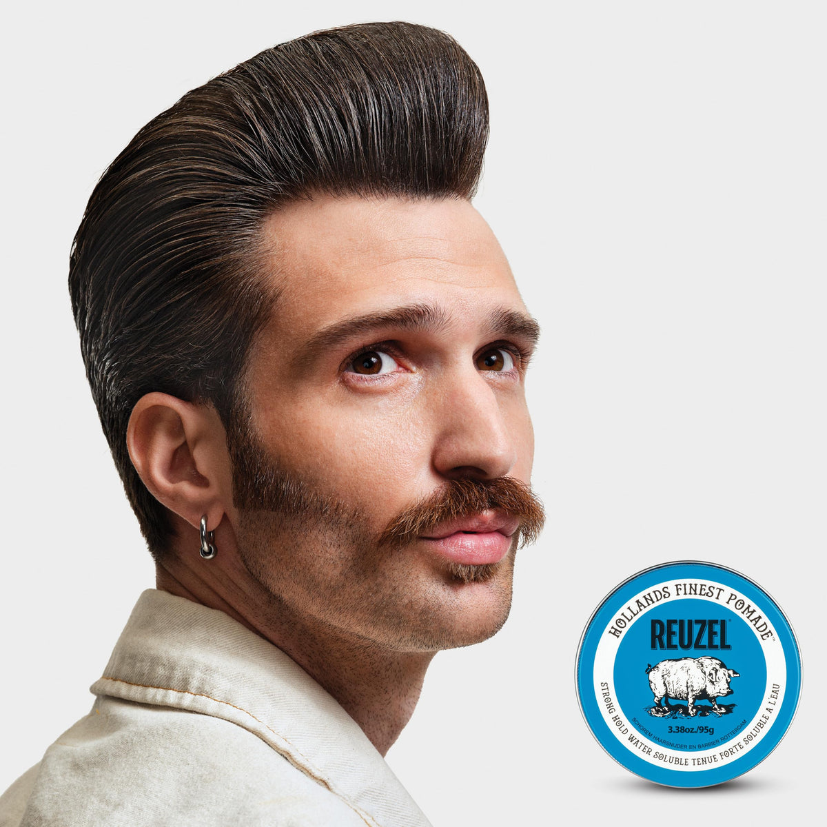 REUZEL close-up texture of pomade showing smooth, spreadable consistency for control