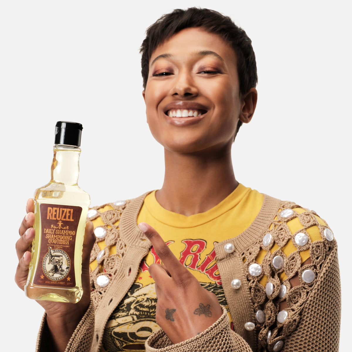 REUZEL packaging layout emphasizing brand identity and product reliability benefit