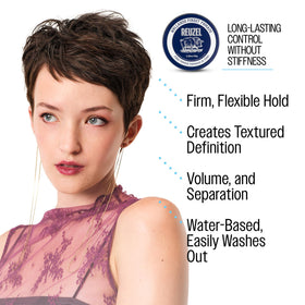 REUZEL product in hand while applying to hair for controlled styling benefit
