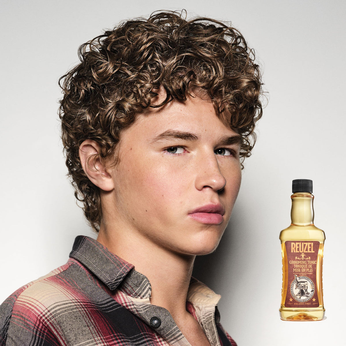 REUZEL tonic pouring from bottle illustrating lightweight, easy application