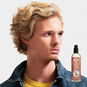 REUZEL Surf Tonic beside common items to show 12oz travel-friendly size