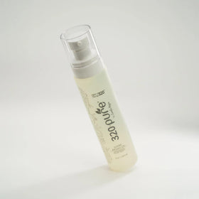 Rev320 styled hair lifestyle shot showing glossy, manageable hair after use